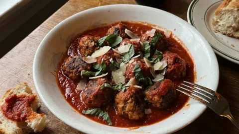 Gordon Ramsay meatballs in tomato sauce with basil and Parmesan served with crusty bread