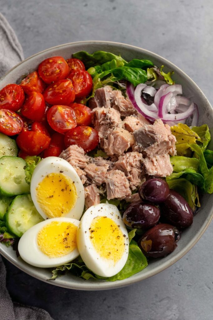Plated Gordon Ramsay tuna nicoise salad recipe with anchovy caper dressing